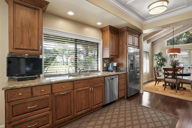 kitchen featuring a sink, lofted ceiling with beams, tasteful backsplash, stainless steel appliances, and dark wood-style flooring