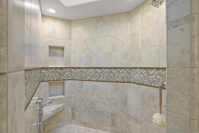 full bathroom with tiled shower