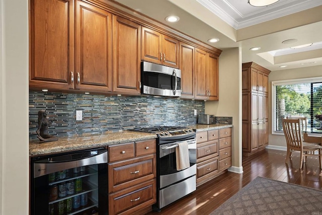 kitchen featuring backsplash, stainless steel appliances, wine cooler, brown cabinetry, and crown molding