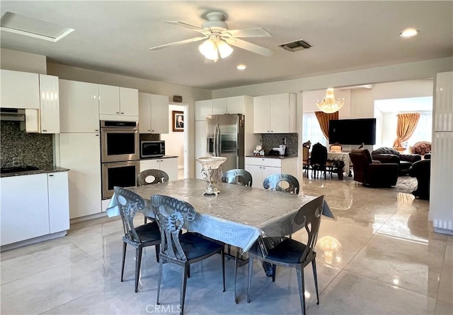 dining space featuring visible vents and a ceiling fan