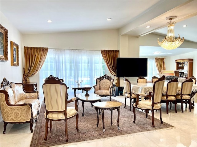 living area featuring recessed lighting, a chandelier, and vaulted ceiling