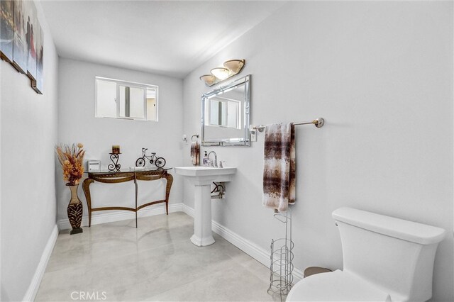 5115 Boda Pl, Woodland Hills, CA 91367 - bathroom with finished concrete floors, toilet, and baseboards