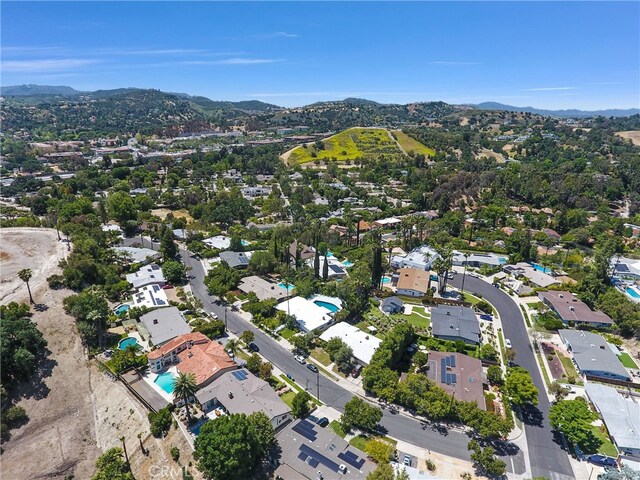 5115 Boda Pl, Woodland Hills, CA 91367 - aerial overview of property's location featuring mountains, nearby suburban area, and a pool