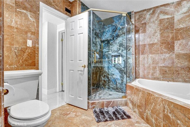 5115 Boda Pl, Woodland Hills, CA 91367 - full bath with marble tiled flooring, a relaxing tiled tub, a marble finish shower, tile walls, and toilet