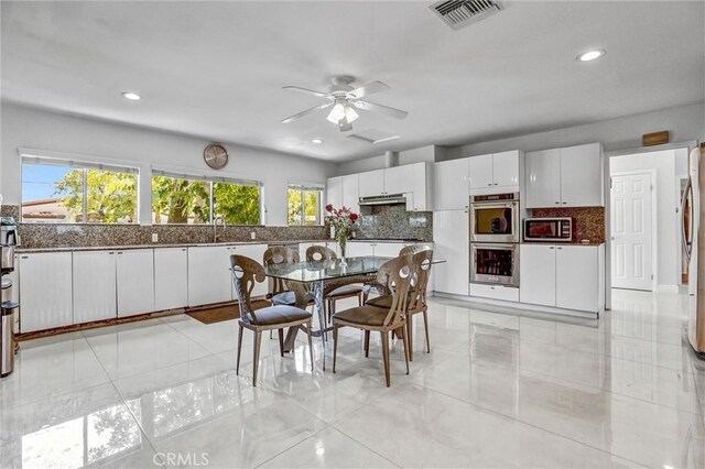 5115 Boda Pl, Woodland Hills, CA 91367 - dining space with plenty of natural light, recessed lighting, ceiling fan, and light tile patterned floors