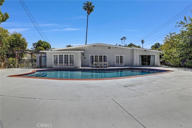 5115 Boda Pl, Woodland Hills, CA 91367 - outdoor pool with french doors and a patio area
