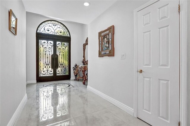5115 Boda Pl, Woodland Hills, CA 91367 - foyer featuring french doors, baseboards, recessed lighting, and light marble finish flooring