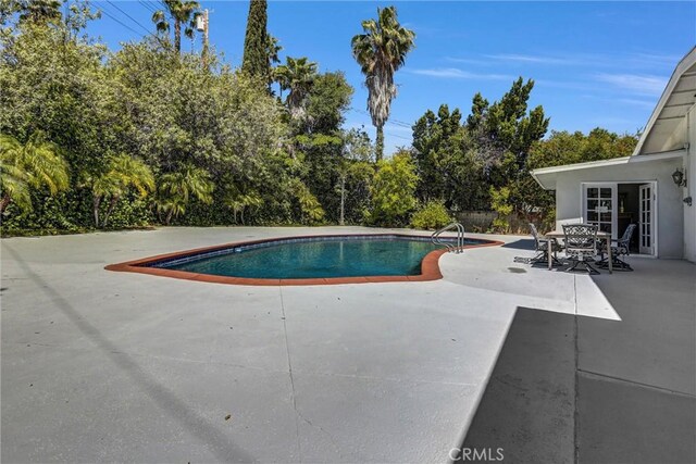 5115 Boda Pl, Woodland Hills, CA 91367 - swimming pool with a patio area, view of scattered trees, and outdoor dining area