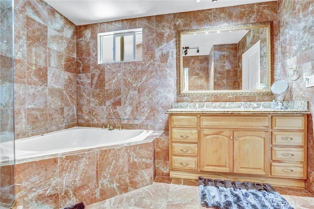 5115 Boda Pl, Woodland Hills, CA 91367 - bathroom with tile walls, a garden tub, and vanity