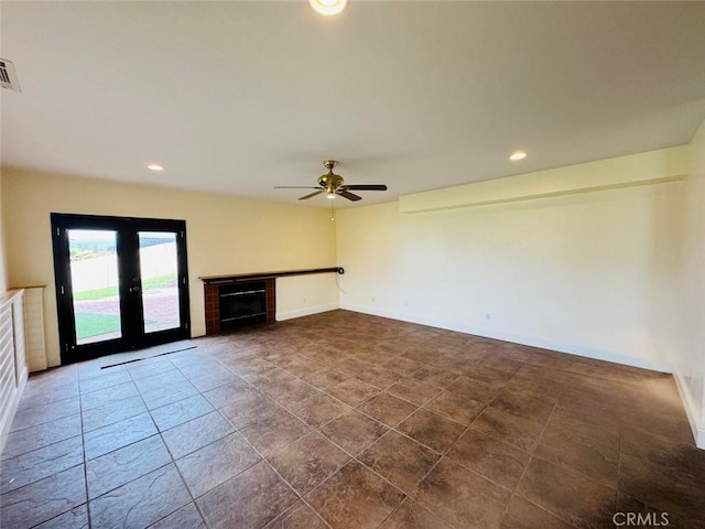 unfurnished living room featuring recessed lighting, baseboards, a fireplace, and a ceiling fan