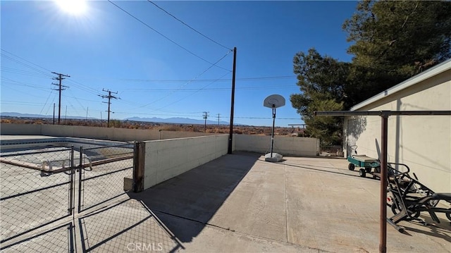 view of patio / terrace with a gate and fence