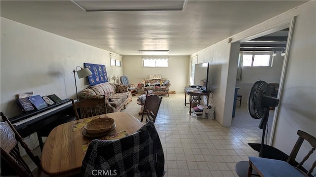 dining area with light tile patterned floors