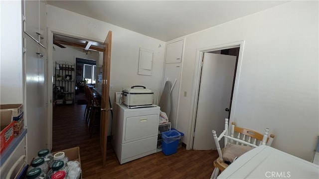 laundry room with wood finished floors and washer / dryer