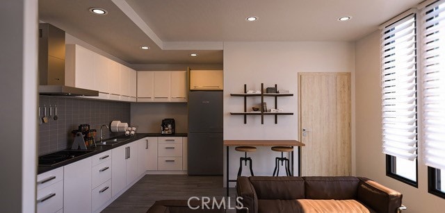 3030 W 12th Pl, Los Angeles, CA 90006 - kitchen with black appliances, wall chimney exhaust hood, decorative backsplash, and a wealth of natural light