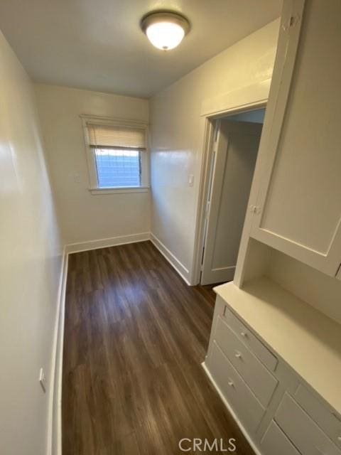 3030 W 12th Pl, Los Angeles, CA 90006 - spare room with baseboards and dark wood-style floors