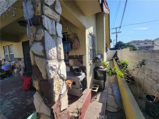 5510 S San Pedro St, Los Angeles, CA 90011 - view of property exterior with stucco siding and fence