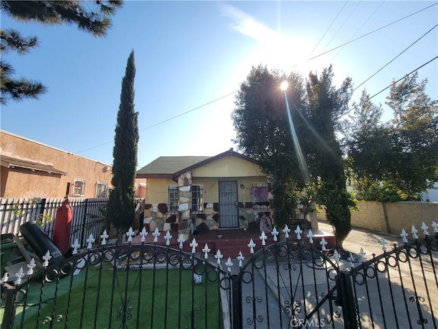 5510 S San Pedro St, Los Angeles, CA 90011 - view of front facade featuring a fenced front yard and stucco siding