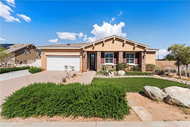 view of front facade with a garage, stucco siding, a tile roof, a front lawn, and driveway
