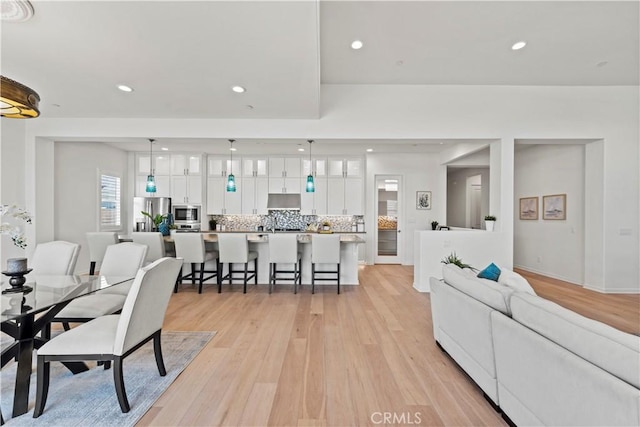 interior space featuring light wood-type flooring and recessed lighting