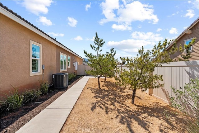 view of yard featuring cooling unit and a fenced backyard