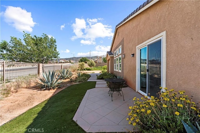 view of yard featuring a patio and fence