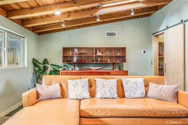 living room featuring lofted ceiling with beams, visible vents, a barn door, and wooden ceiling