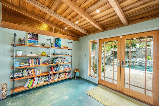 sitting room with lofted ceiling with beams, french doors, concrete flooring, and wooden ceiling