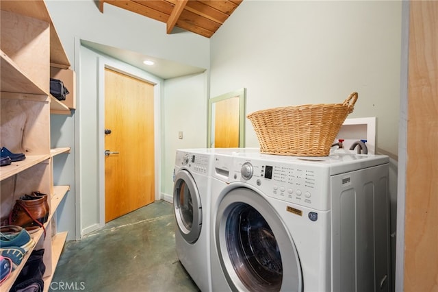 laundry room with washer and dryer, wooden ceiling, and laundry area