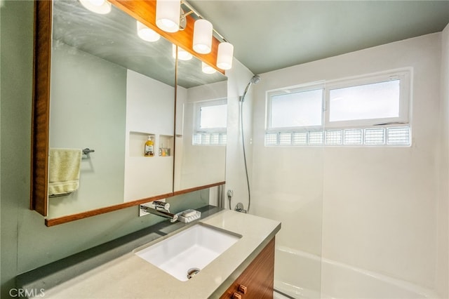 bathroom featuring vanity and shower / bathtub combination