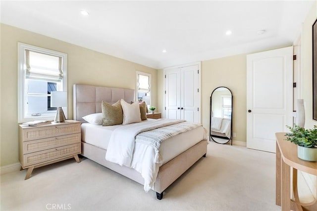129 Via Waziers, Newport Beach, CA 92663 - bedroom with multiple windows, light carpet, baseboards, and recessed lighting