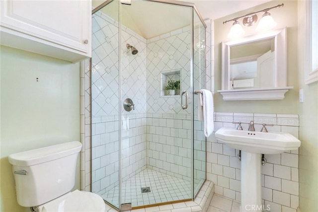 129 Via Waziers, Newport Beach, CA 92663 - bathroom with toilet, tile walls, and a shower stall