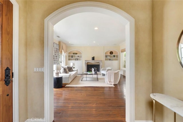 129 Via Waziers, Newport Beach, CA 92663 - entrance foyer with hardwood / wood-style floors, arched walkways, baseboards, and recessed lighting