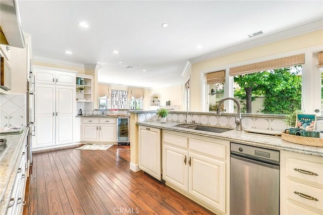 129 Via Waziers, Newport Beach, CA 92663 - kitchen with a sink, crown molding, tasteful backsplash, beverage cooler, and light stone countertops