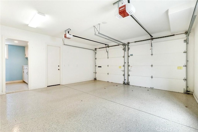 129 Via Waziers, Newport Beach, CA 92663 - garage featuring a garage door opener
