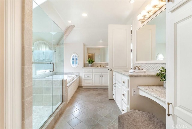 129 Via Waziers, Newport Beach, CA 92663 - full bath with a shower stall, vanity, a garden tub, recessed lighting, and decorative backsplash