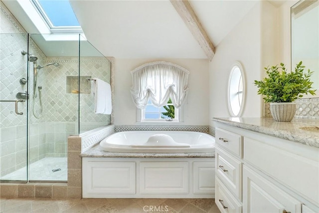 129 Via Waziers, Newport Beach, CA 92663 - bathroom featuring a garden tub, a shower stall, vanity, and a skylight