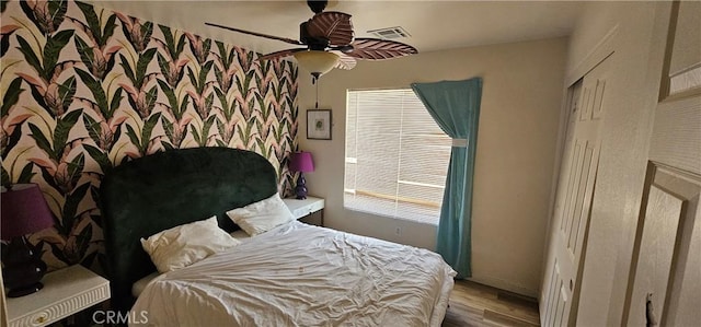 15781 Coral St, Palm Springs, CA 92262 - bedroom with wood finished floors and ceiling fan