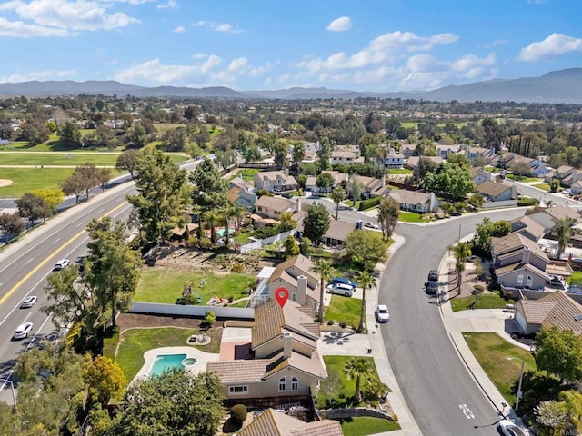 birds eye view of property featuring a mountain view and a residential view