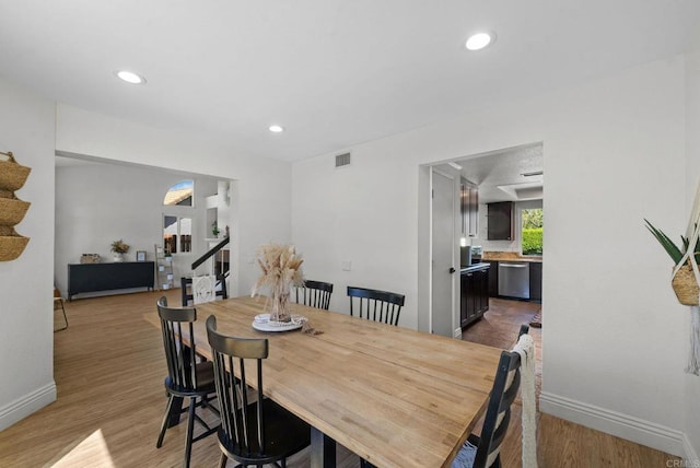 dining area with visible vents, stairs, baseboards, light wood finished floors, and recessed lighting