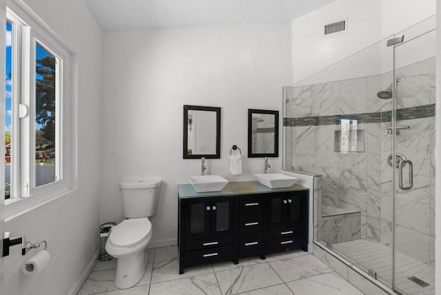 bathroom featuring a sink, visible vents, toilet, and marble finish floor