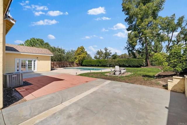 view of patio featuring a fenced in pool, central AC, french doors, and fence