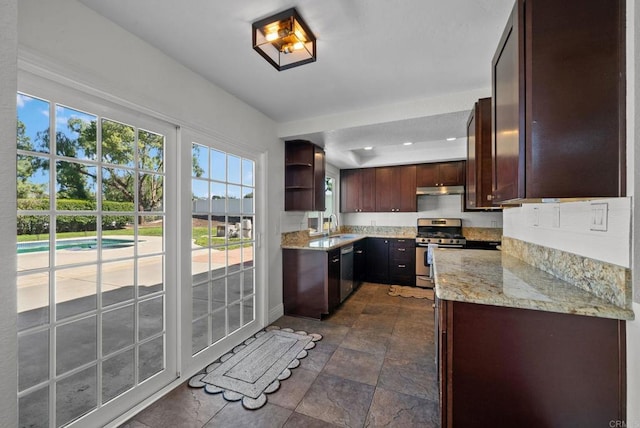 kitchen with open shelves, under cabinet range hood, light stone counters, a sink, and appliances with stainless steel finishes
