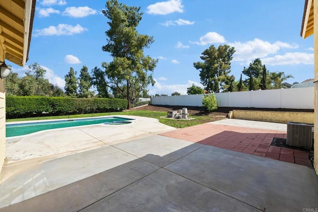 view of pool featuring a fenced backyard, a fenced in pool, a patio, and cooling unit