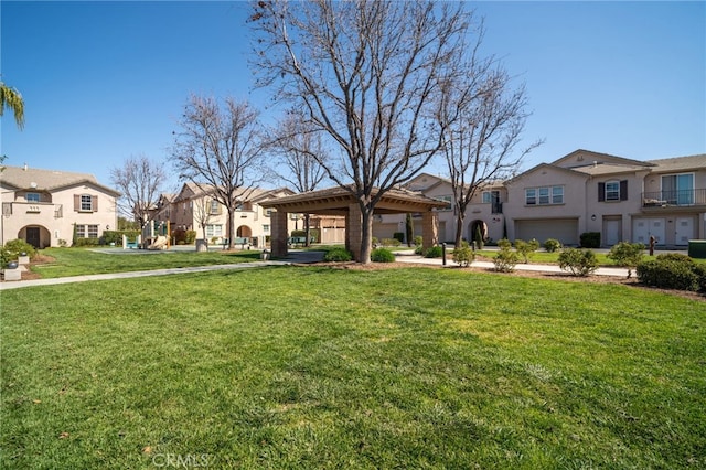 36337 Vincenzo Way, Winchester, CA 92596 - view of front facade with stucco siding, a residential view, a front lawn, an attached garage, and a gazebo