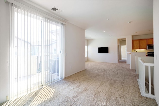 36337 Vincenzo Way, Winchester, CA 92596 - unfurnished living room featuring light carpet