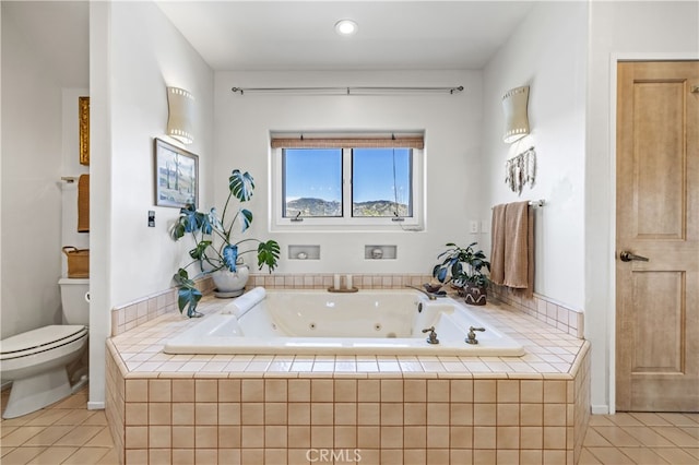 full bathroom featuring toilet, tile patterned floors, a tub with jets, and recessed lighting