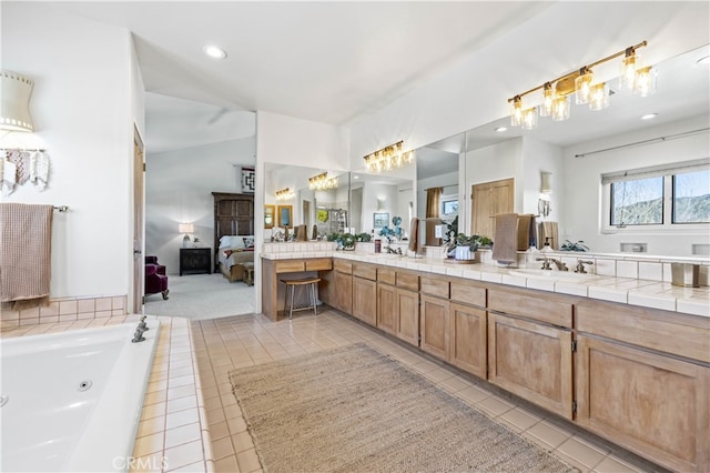 full bathroom featuring recessed lighting, vanity, ensuite bathroom, and a jetted tub