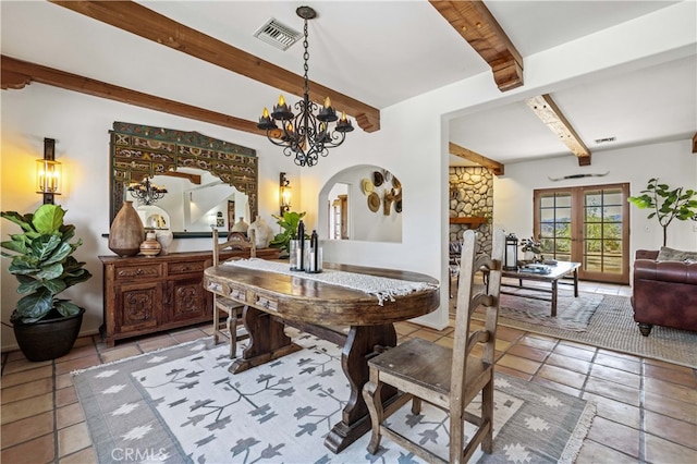 dining room featuring visible vents, light tile patterned floors, arched walkways, a chandelier, and beam ceiling