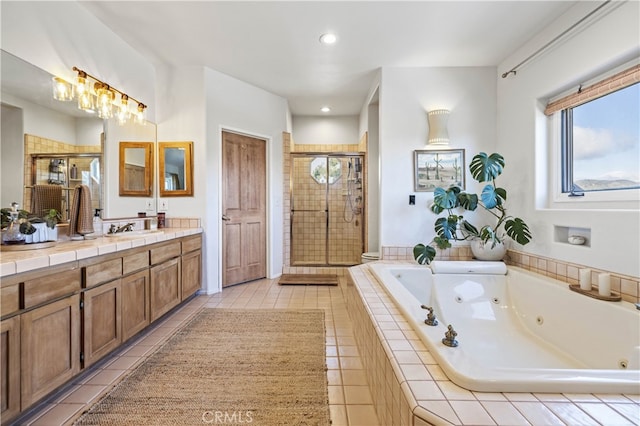 full bath featuring a whirlpool tub, a shower stall, tile patterned flooring, and recessed lighting