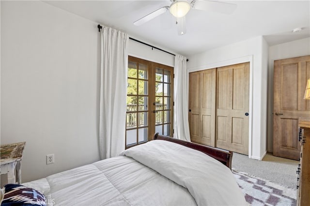 carpeted bedroom featuring a closet and a ceiling fan